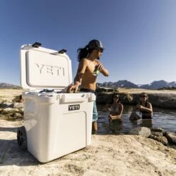 Yeti Roadie 60 White - Wheeled Cooler -Kamado Joe Sae Gross20YETI Roadie 48 Wholesale LifestyleImage 2400x2400 05